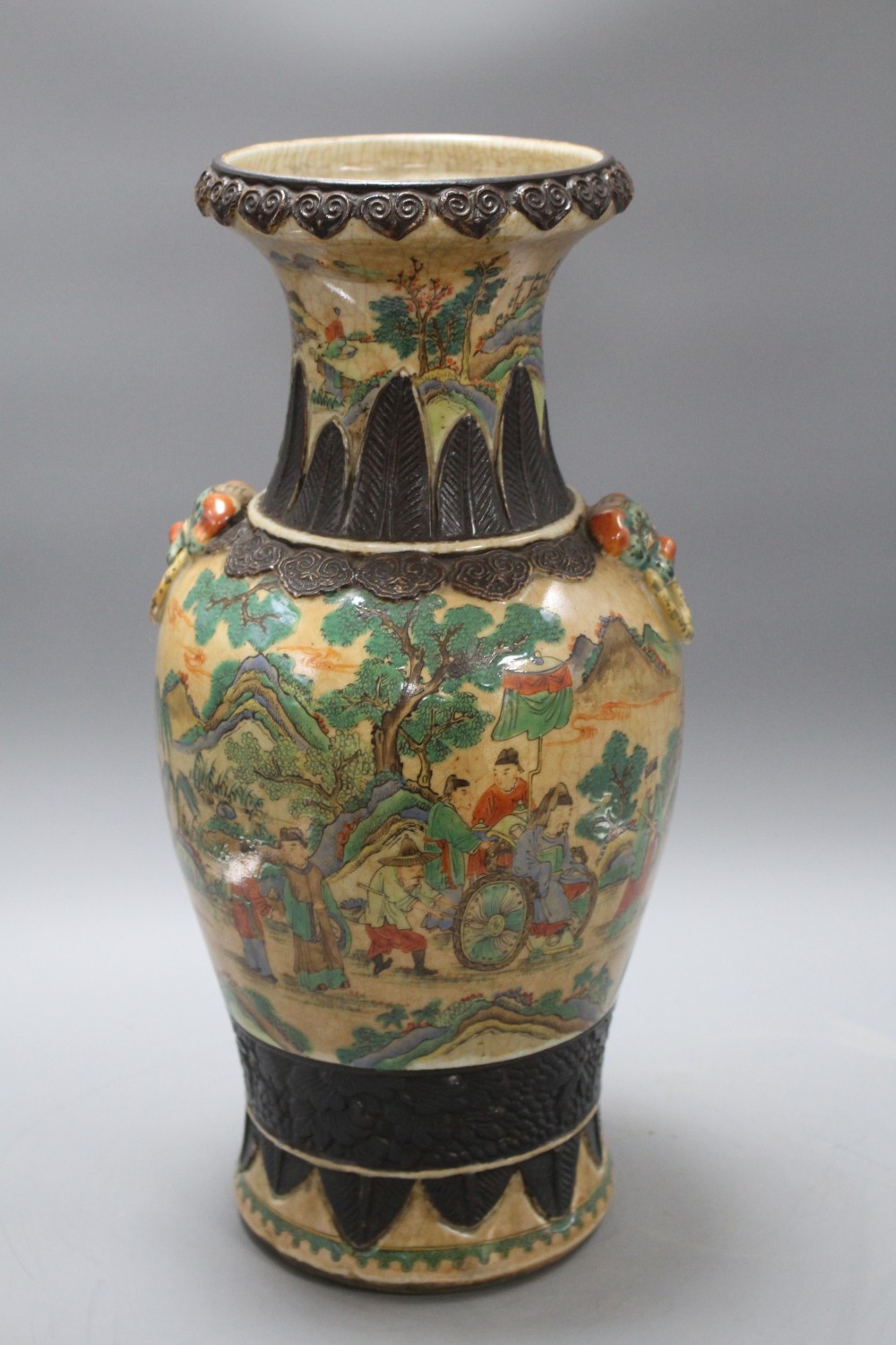 A late 19th century Chinese crackle glaze vase, decorated with figures in a continuous landscape, height 46cm
